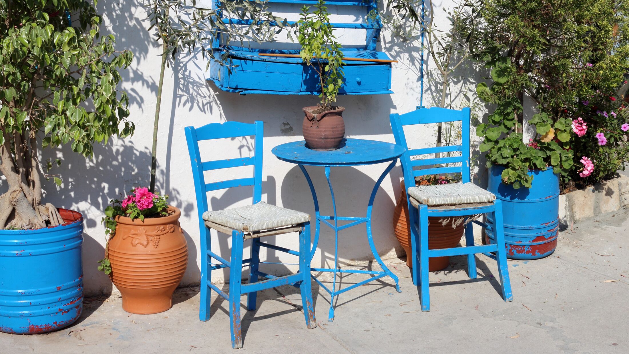 Bright blue wooden chairs in the Greek village of Adele on the island of Crete
