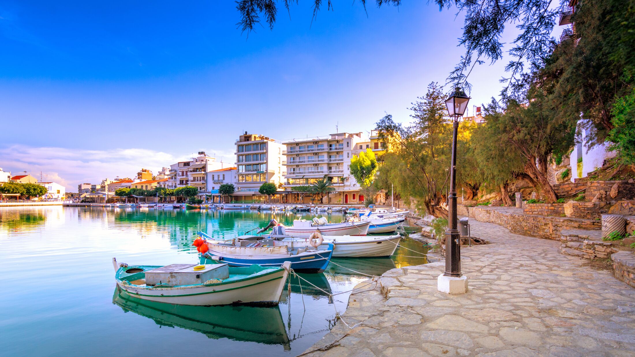 The lake Voulismeni in Agios Nikolaos,  a picturesque coastal town with colorful buildings around the port in the eastern part of the island Crete, Greece