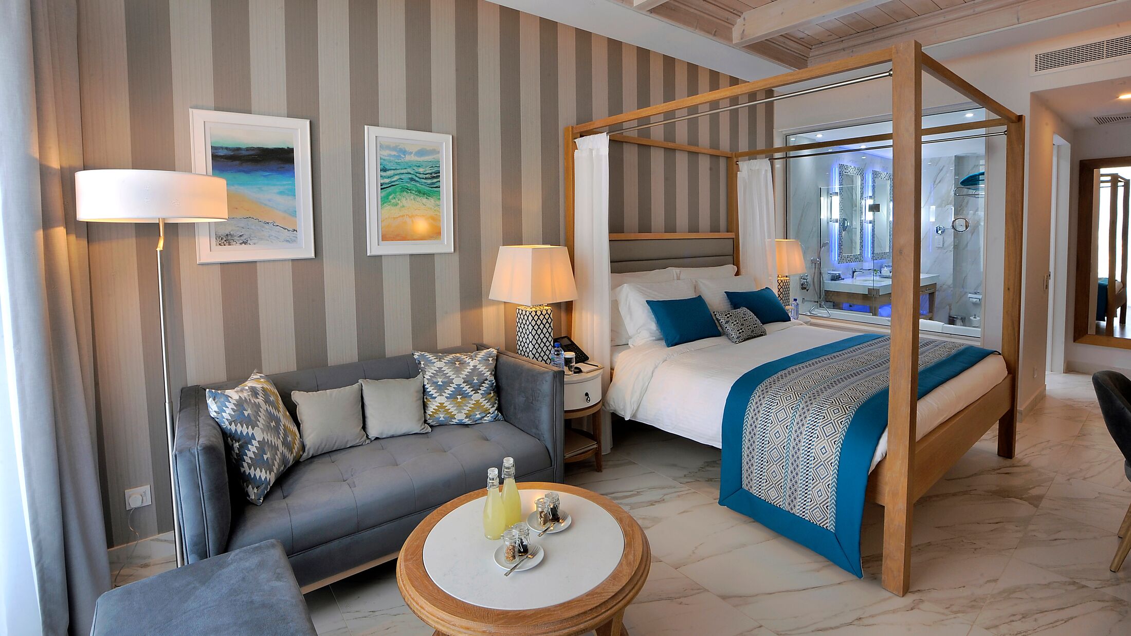 a living room filled with furniture and a large window