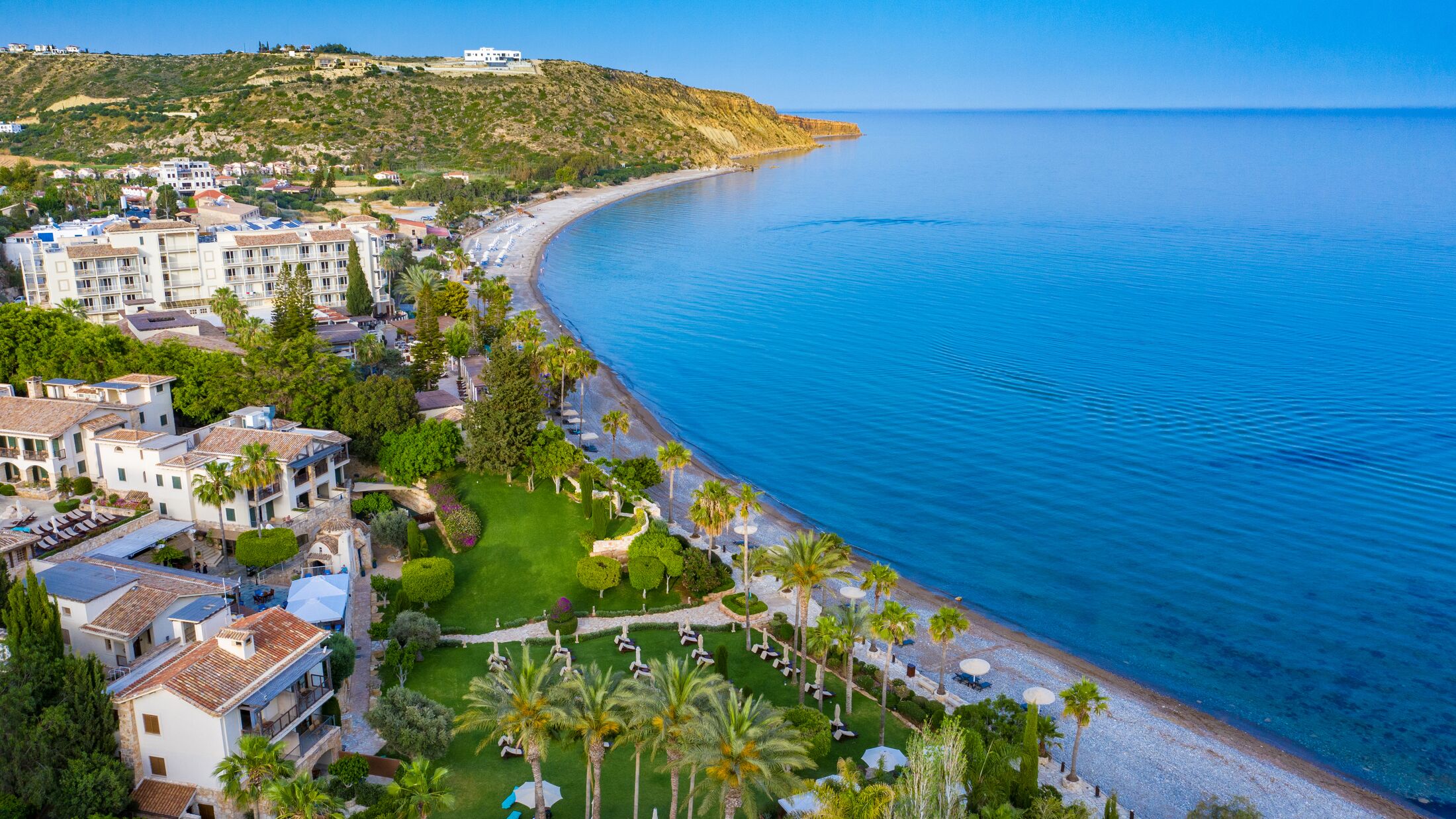 Cyprus. Pissouri top view. The beaches of Cyprus. Pissouri Village The coast of the Mediterranean Sea. Resort hotels with pools on the coast. The coast of Cyprus. Holidays in the resorts of Pissouri