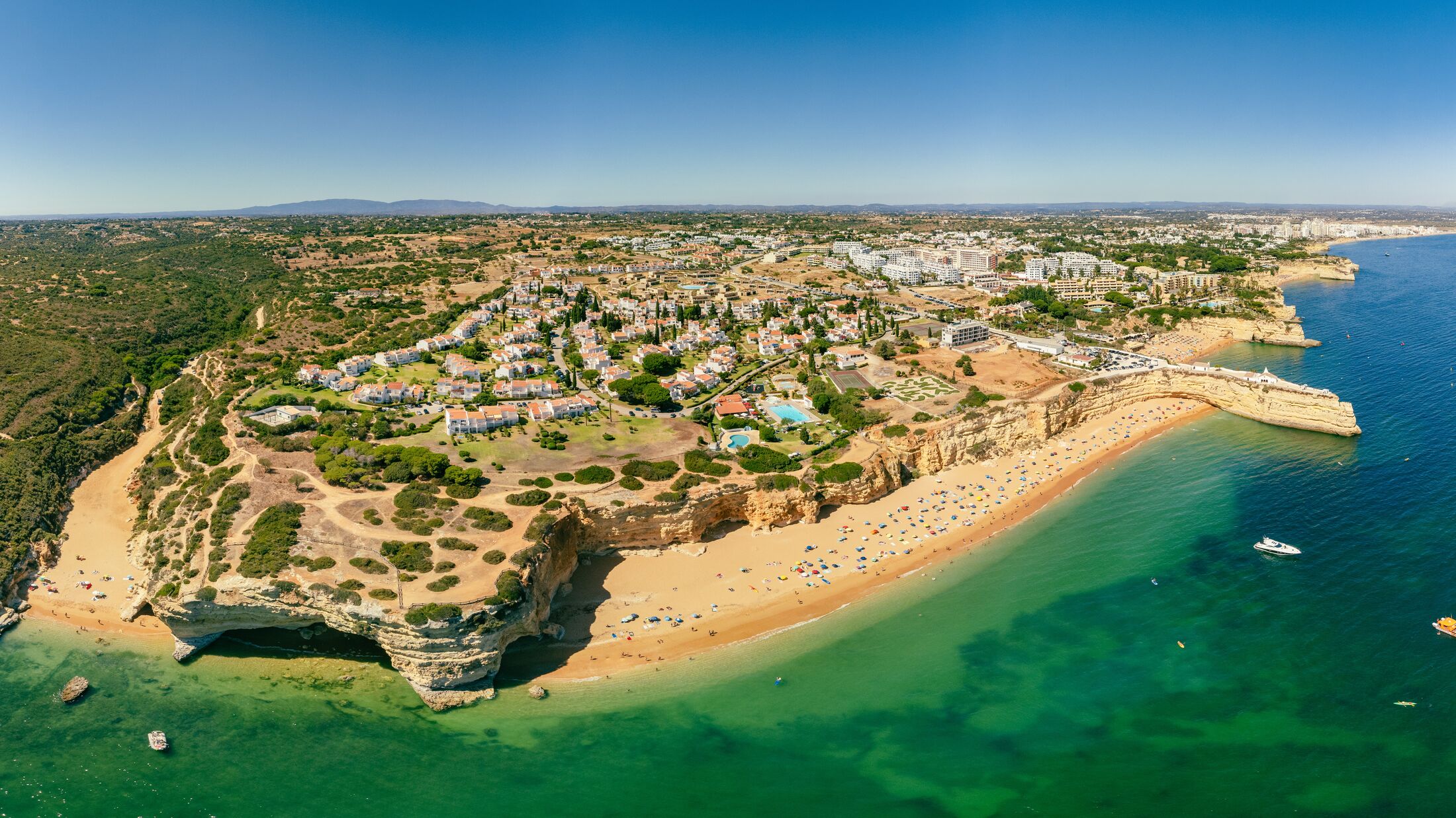 Aerial drone panoramic views of Praia Nova and Praia de Nossa beach, Algarve, Portugal